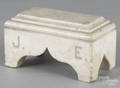 Marble sarcophagus doorstop