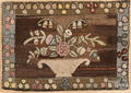 American hooked rug with a basket of flowers