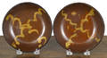 Two similar Pennsylvania redware shallow bowls 19th c