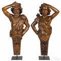Pair of French carved walnut figureheads of a man and woman 19th c