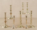 Four pair of brass candlesticks