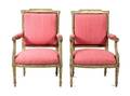 A Pair of Louis XVI Style Carved and Painted Fauteuils