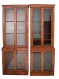 A Pair of George III Style Walnut Bookcase Cabinets