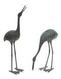 A Pair of Patinated Metal Standing Cranes