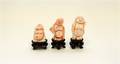 A Group of Three Carved Coral Figures