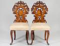 SET OF TEN BLACK FOREST CARVED WALNUT SIDE CHAIRS