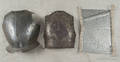 Two iron breast plates
