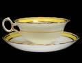TWELVE ENGLISH YELLOW GROUND CUPS AND SAUCERS