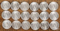 Eighteen silver Peace dollars