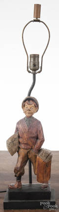 German carved and painted clockwork newsboy table lamp