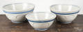 Three blue and white stoneware mixing bowls