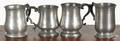 Four pewter mugs