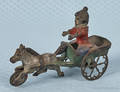 Cast iron girl in cart bell toy