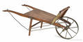 Wooden salesman sample wheelbarrow bearing a metal tag