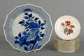 Eight Limoges floral plates