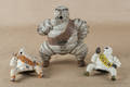 Three cast Michelin Man advertising figures