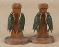 Pair of carved and painted bird form candlesticks