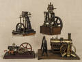 Four cast iron live steam toy engines