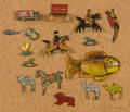 Seventeen small tin litho animals and vehicles