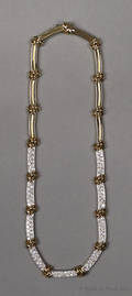 18K yellow gold and diamond necklace with alternating gold knots and pave set diamonds