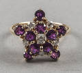 14K yellow gold ruby and diamond ring with a star motif
