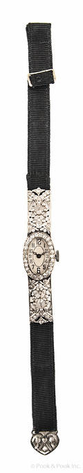 Ladies diamond encrusted wristwatch with a platinum case