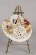 French porcelain clock face in the shape of an artists palette with a brass eagle support