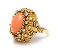 An 18 Karat Yellow Gold Coral and Diamond Ring