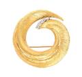 An 18 Karat Yellow Gold and Diamond Swirl Brooch