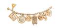 A 14 Karat Yellow Gold Bracelet with Eight Attached Charms