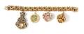 A 14 Karat Yellow Gold Bracelet with Four Attached Charms