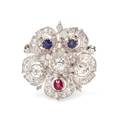 A Silver Topped Gold Diamond Ruby and Sapphire Flower Motif PendantBrooch