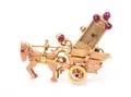 A Retro Bicolor Gold and Ruby Wagon and Driver Motif Lapel Watch