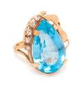 A Yellow Gold Blue Topaz and Diamond Ring