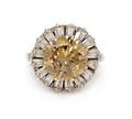 A Platinum Fancy Yellowish Brown Diamond and Diamond Ring