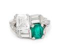 A Platinum Diamond and Emerald Ring