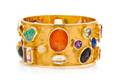An 18 Karat Yellow Gold and Multigem Bangle Bracelet