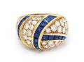 An 18 Karat Yellow Gold Diamond and Sapphire Bombe Ring
