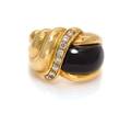 An 18 Karat Yellow Gold Onyx and Diamond Ring