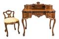 A Baroque Style Carved Writing Desk and Chair