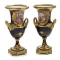 A Pair of Sevres Style Gilt Bronze Mounted Porcelain Urns