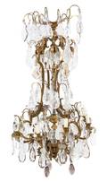 A French Gilt Bronze and Rock Crystal EightLight Chandelier