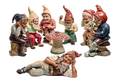 A Collection of Seven German Painted Terra Cotta Gnomes