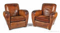 Two leather club chairs