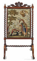 Victorian rosewood fire screen with a needlework panel