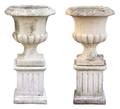 A Pair of Composite Stone Campana Garden Urns
