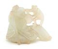 A Carved White Jade Figure of a Man and Monkey