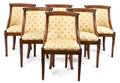 A Set of Six Barrel Back Mahogany Dining Chairs