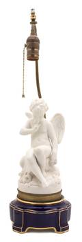A French Bisque Porcelain Cupid