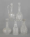 Five colorless glass decanters